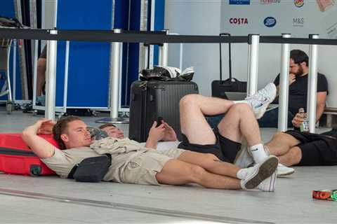 Travel chaos as passengers get stuck in long queues at Stansted airport & sleep on FLOOR ahead..