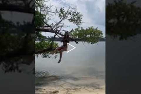 Woman Jumps Off Tree and has a Swimsuit Fail