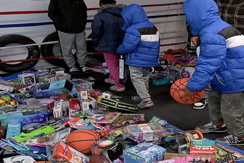 Houston boxing gym Sweet Science Boxing Academy gives away piles of toys to families Christmas..