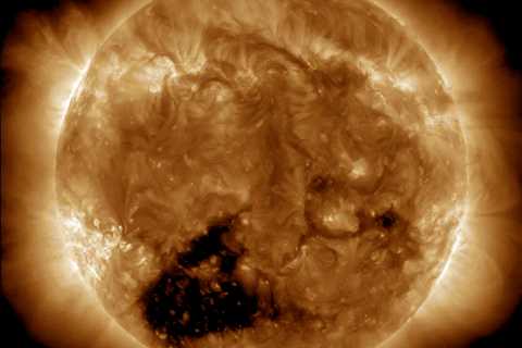 A 'hole' 30 times Earth's size has spread across the sun, blasting solar winds that'll hit our..