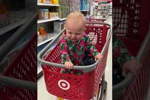 Girl laughs her heart out while watching mama hula-hooping