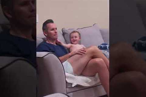 Naughty baby boy puts booger on dad's face