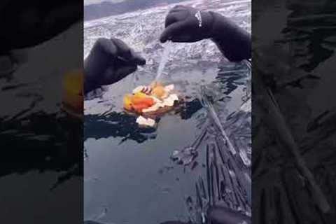 Divers have picnic among ice shards on frozen Lake