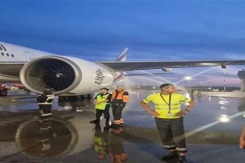 Terrifying moment smoke pours out of Emirates plane as passengers evacuated and firefighters douse..