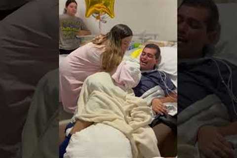 Father wakes from coma to meet newborn son