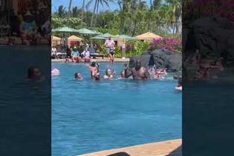 Shaquille O'Neal high-fives kids at Hawaii hotel