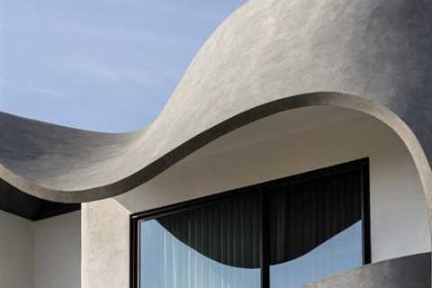 Studio Ardete wraps sculptural concrete pores and skin round Ribbon Home