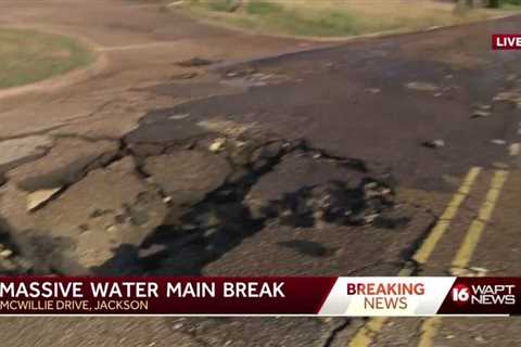 Water main break shreds street