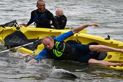 Lib Dem leader Sir Ed Davey, 57, falls out of kayak at party conference amid smear row with Labour