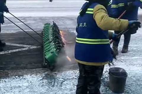 Sanitation workers ignite flames to tackle icy streets