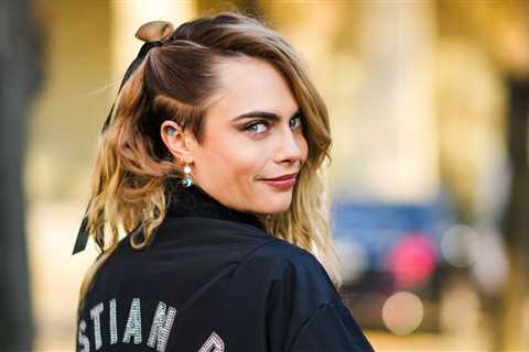 Cara Delevingne Looks Unrecognizable With Blunt Bangs and Dark Hair — See Photos