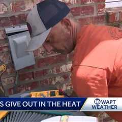 AC repairmen working overtime during heatwave