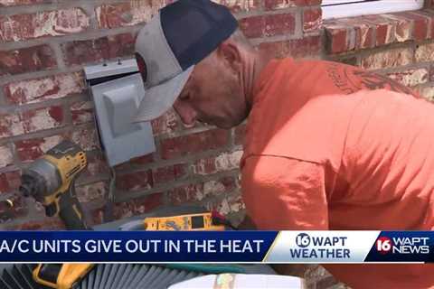 AC repairmen working overtime during heatwave