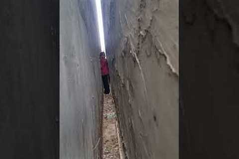 Girl Rescues Cat From Extremely Narrow Passage